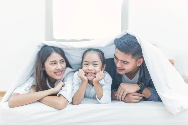 A happy asia family with kids in the living, Happy family mother, Father, Child daughter at home, Happy loving family, Father and his daughter child girl playing together