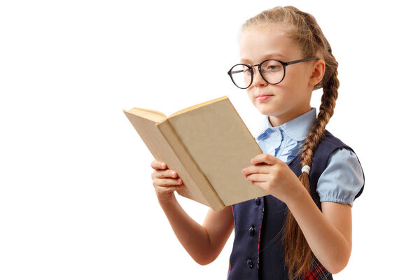 Little girl reading a book isolated on white background. 