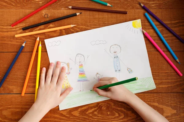 Character Child Drawing Image on Wooden Table