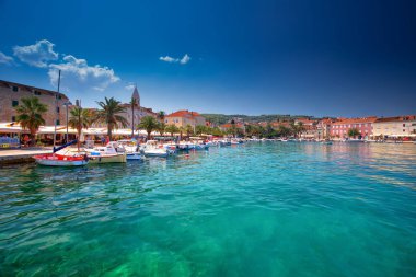 SUPETAR, CROATIA - August 6, 2018 - Harbour in Supetar, Brac, Croatia.  clipart