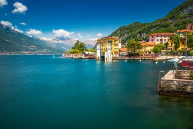 VARENNA, ITALY - June 1, 2019 - Varenna old town with the mountains in the background, Italy, Europe clipart