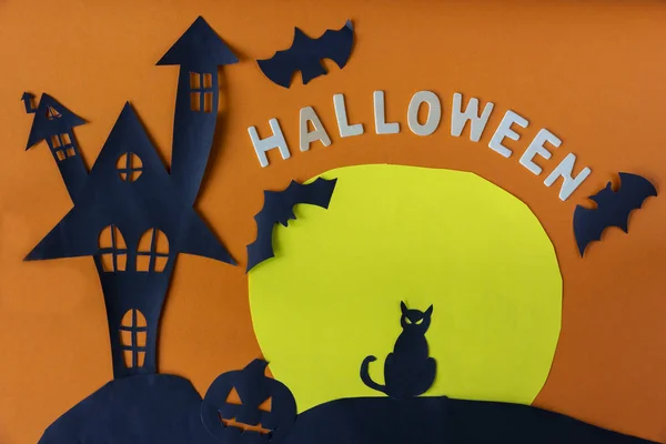 Happy Halloween with haunted house castle and black cat and moon and pumpkin on orange background.