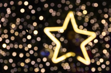 Noel tatil arka plan arka plan ve mutlu yeni yıl için bulanık Noel glittler yıldız ışık