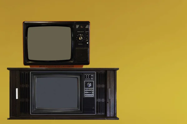 Vintage Television or old retro TV on iyellow background