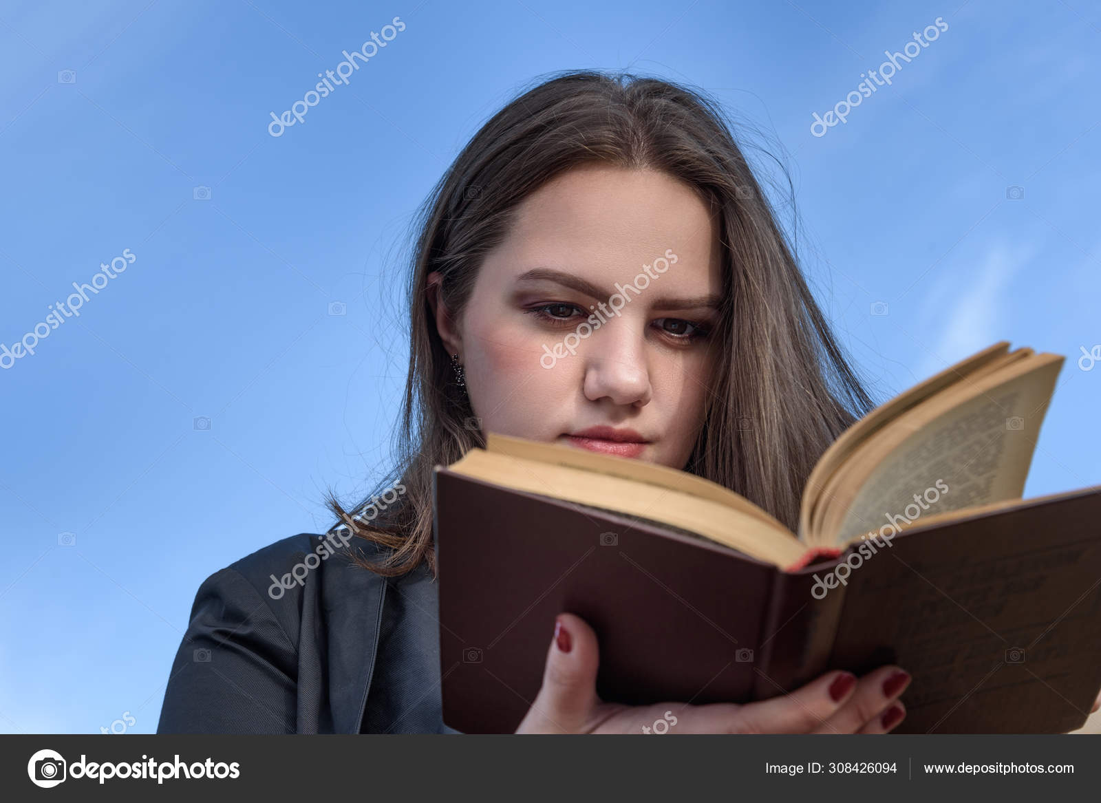 Brunette Girl Reading Book On Bench On The Street Girl In Black