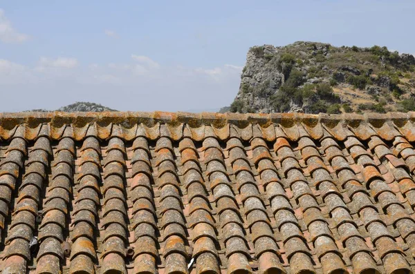 Roof tile and mountain Stock Image
