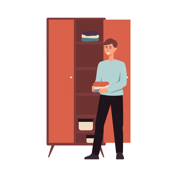 Happy man organising clothes in a closet, young male cartoon character standing beside wardrobe — Stock Vector