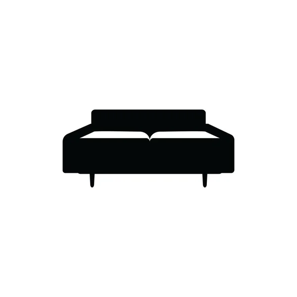 Черный диван на белом фоне - темный плоский контур — стоковый вектор