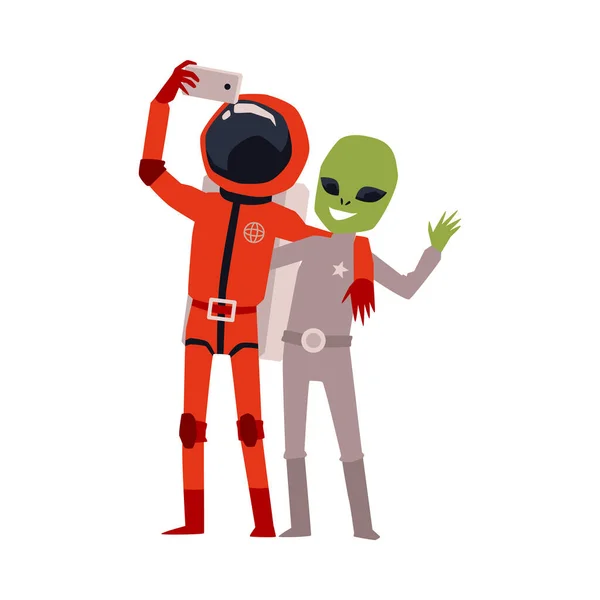 Çizgi film astronotu ve yeşil uzaylı selfie çekiyorlar. — Stok Vektör