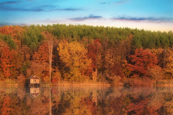 Wooden house in autumn nature