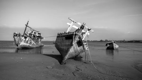 Broken and old fishing boat , Three Ship Wreck in Kuala Penyu, Sabah, Malaysia , Abandoned Ship at sabah borneo malaysia Image has grain or blurry or noise and soft focus when view at full resolution.