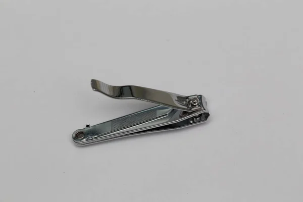 used metallic nail cutters against white background