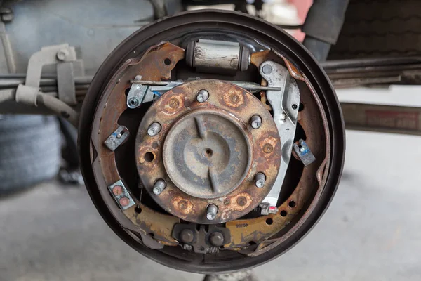 Closeup of car disc brake at car workshop-Technical concept