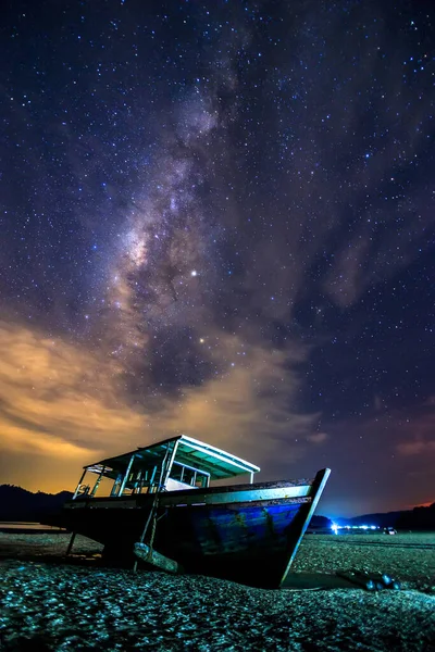 Amazing beautiful of night sky Milky Way Galaxy with abandon fisherman boat - Travel Concept