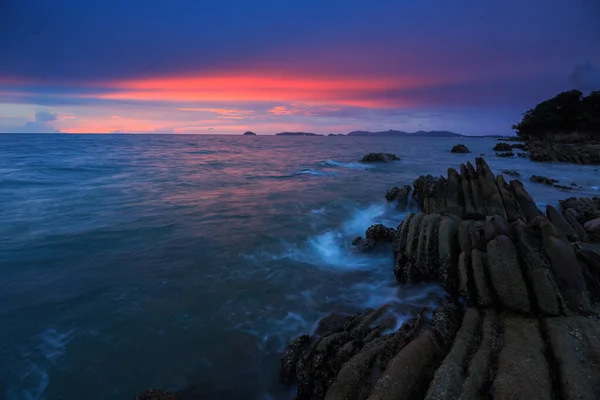 Sunset Twilight with ocean flow over the rocks at Borneo-Nature landscape concept