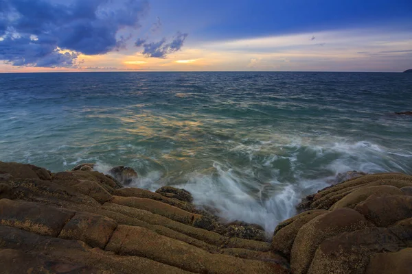 Sunset Twilight with ocean flow over the rocks at Borneo-Nature landscape concept