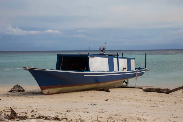 Fishing boat in the sea with anchored in the sea - Travel Concept
