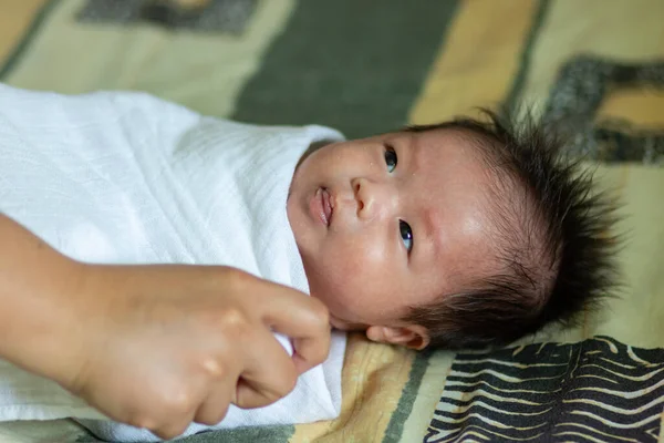 Asia Chinese Baby newborn on the bed, New family and baby healthy concept