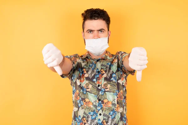 Young Handsome Man Protective Mask Holding Two Thumbs Dislike Concept — Stock Photo, Image