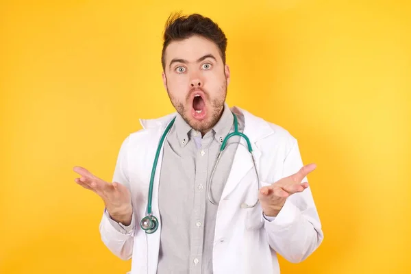 Frustrated European Doctor Man Wearing Medical Uniform Puzzled Hesitant Shrugs — Stock Photo, Image
