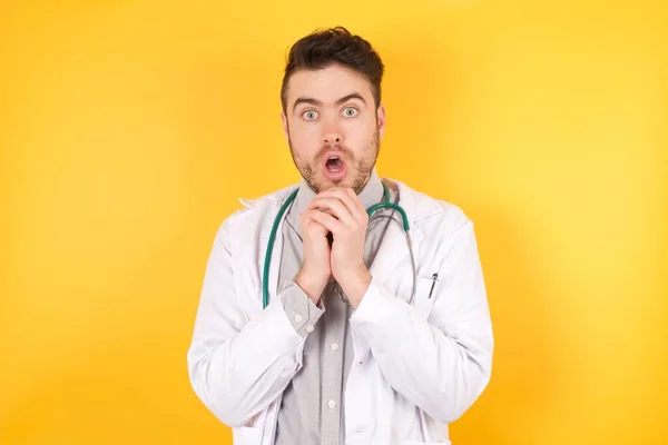 Young Caucasian Doctor Man Wearing Medical Uniform Praying Luck Has — Stock Photo, Image