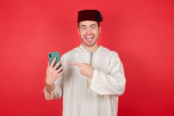 Handsome Young Man Wearing Traditional Turkish Hat Fez Using Smartphone — Stock Photo, Image