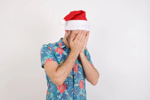 Crying Man Studio Covering Face Hands Wearing Christmas Santa Hat — Stock Photo, Image