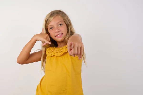 Cute Little Girl Smiling Cheerfully Pointing Camera While Making Call — Stock Photo, Image