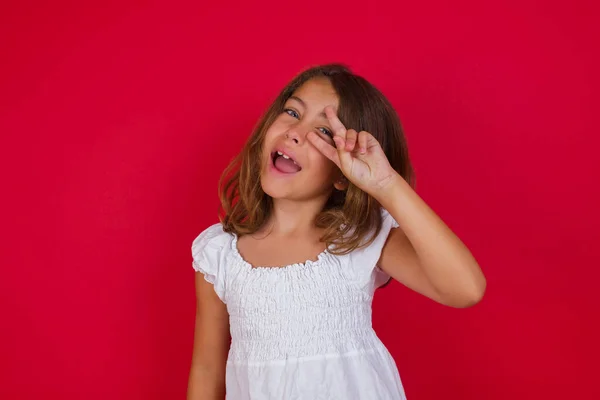 Cute Little Girl Doing Peace Symbol Fingers Face Smiling Cheerful — Stock Photo, Image