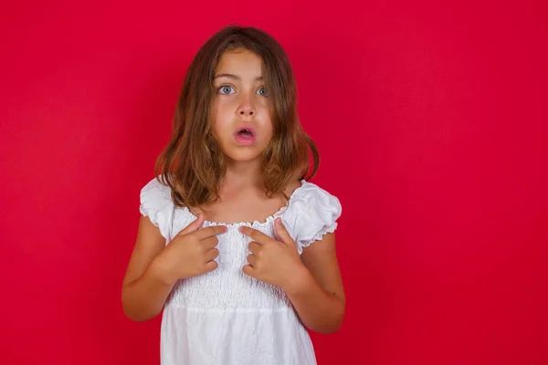 Little Caucasian Girl Beautiful Blue Eyes Indicates Herself Puzzled Expression — Stock Photo, Image