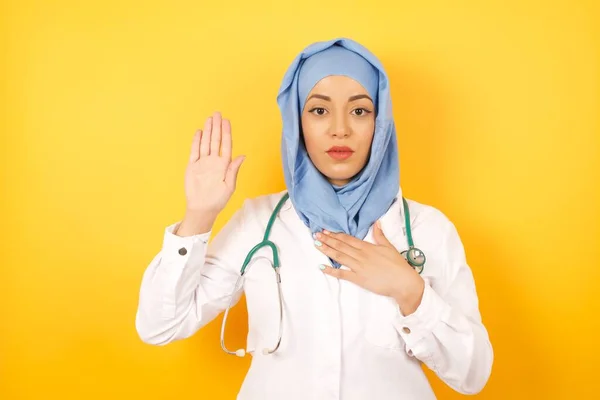 Young Female Doctor Wearing Medical Uniform Swearing Hand Chest Open — Stock Photo, Image