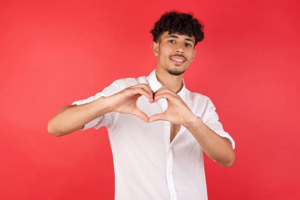 Joven Hombre Guapo Haciendo Forma Símbolo Del Corazón Con Las — Foto de Stock