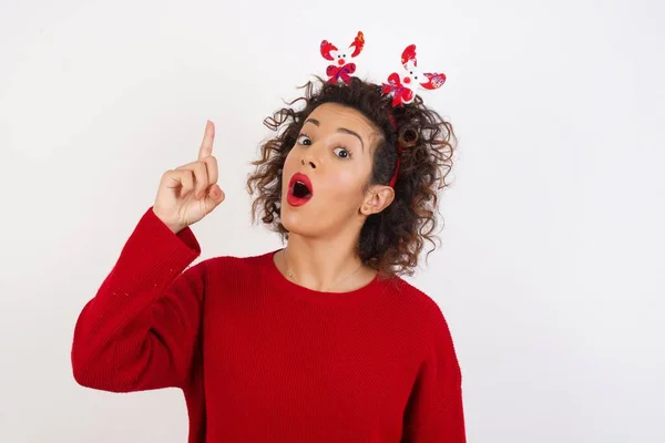 Young Woman Wearing Deer Horns Headband Pointing Finger Successful Idea — Stock Photo, Image