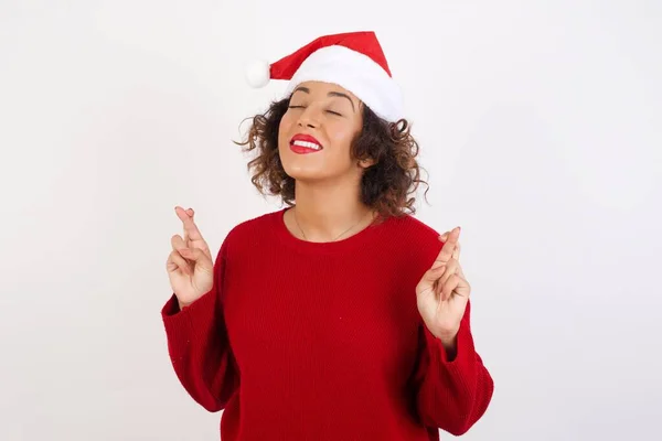 Woman Santa Claus Hat Fingers Crossed Closed Eyes — Stock Photo, Image