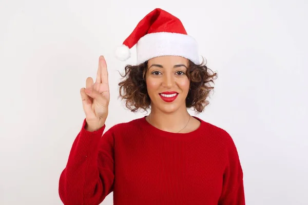 Woman Wearing Santa Claus Hat Pointing Two Fingers Smile Camera — Stock Photo, Image