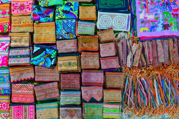Handicraft souvenir shop in the night market of Luang Prabang, Laos, South East Asia. Directly above view, colorful pattern, gift tourist. — Stock Photo, Image