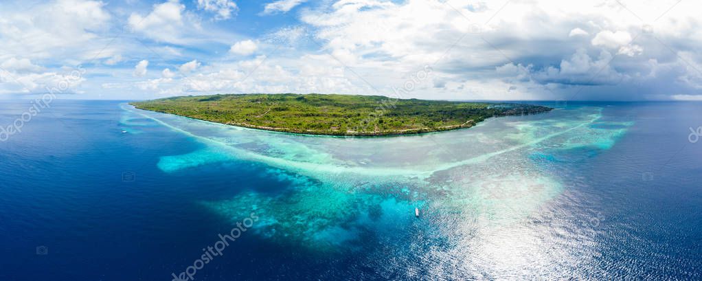 Aerial view tropical beach island reef caribbean sea. Indonesia Wakatobi archipelago, Tomia Island, marine national park. Top travel tourist destination, best diving snorkeling.