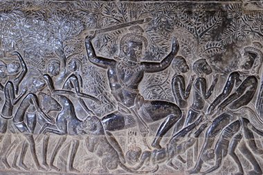 Angkor Wat tapınağının duvarına oyulmuş ünlü bas reflief, dünya mirası ve en çok ziyaret edilen turistik yer, Kamboçya. Ayrıntılar, destansı savaşlar kaya oyma yakın çekim.