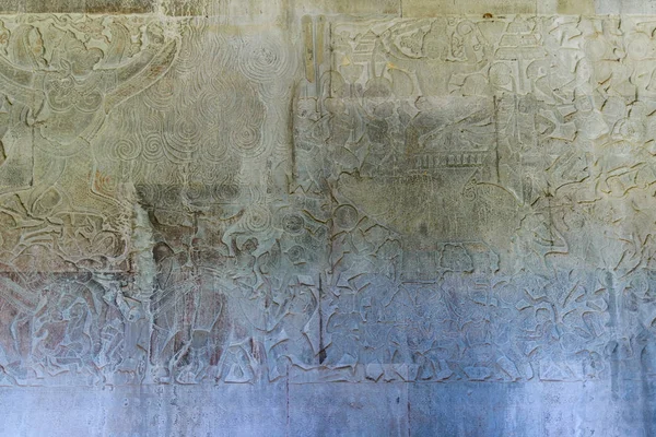 Beroemde bas reflief uitgehouwen in de muur van Angkor Wat tempel, werelderfgoed en meest bezochte toeristische site, Cambodja. Details, close-up van epische gevechten Rock Carving. — Stockfoto