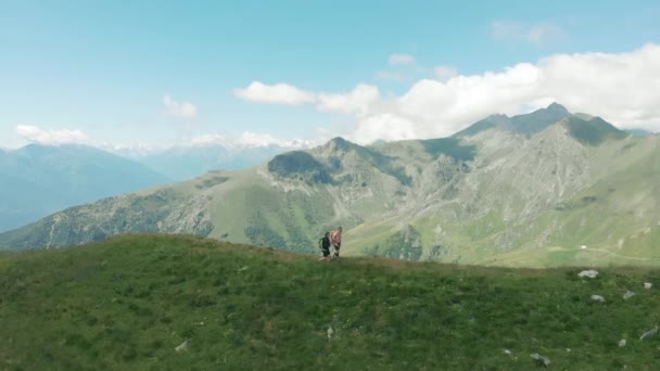 Aerial Slow Motion Couple Backpackers Hiking Mountain Top Scenic Landscape — Stock Video