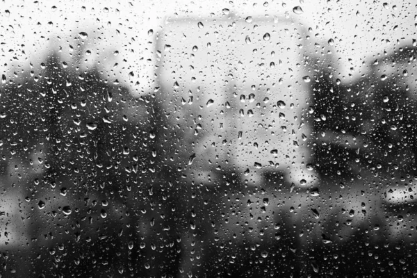 Drops of water on the window glass. Black and white — Stock Photo, Image