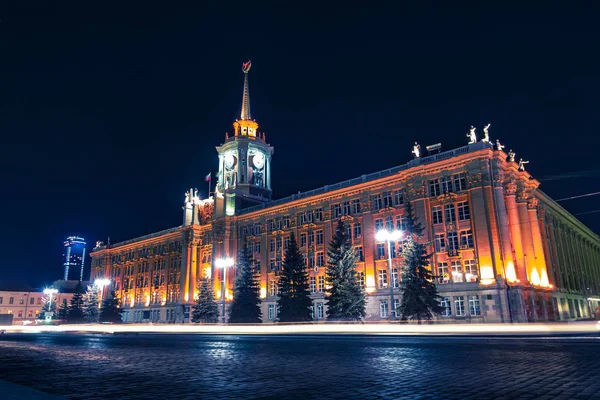 Light car trails in front of Yekaterinburg city center at night