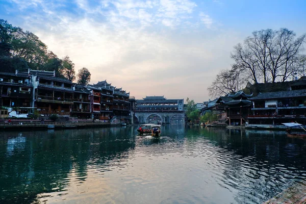 The Fenghuang Ancient Town.Fenghuang County has an exceptionally well-preserved ancient town that harbors unique ethnic languages, customs, arts as well as many distinctive architectural remains of Ming and Qing styles.