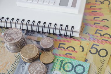 Australian money, calculator, notebook, saving concept. clipart