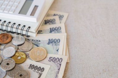 Japon yeni parayla, hesap makinesi, Not defteri, kopya alan arka plan