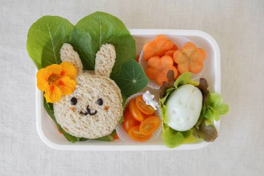 Easter Bunny healthy lunch box, fun food art for kids clipart