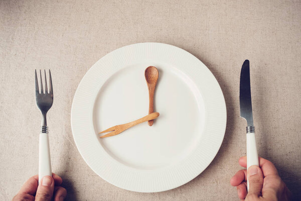 white plate with knife and fork, Intermittent fasting concept, ketogenic diet, weight loss
