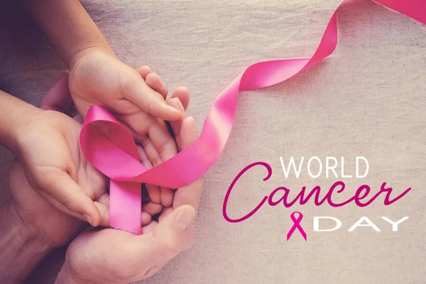 Human Hands Holding Pink Ribbon World Cancer Day — Stock Photo, Image