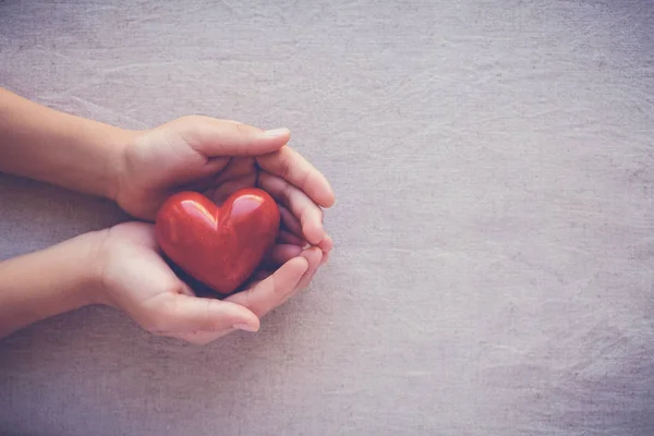 Child Hands Holiding Red Heart Health Care Love Family Concept — Stock Photo, Image