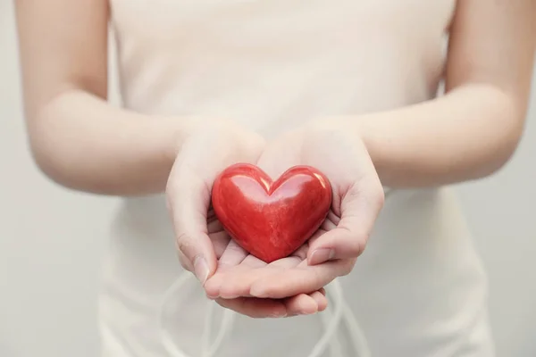 Young Woman Holding Red Heart Hands Health Insurance Donation Concept — Stock Photo, Image